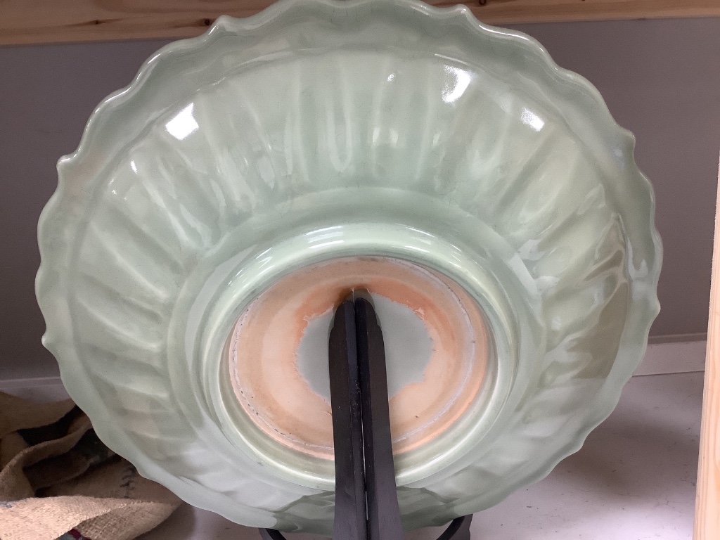 A Chinese circular celadon dish with scalloped rim, diameter 36cm, and a similar bowl, both with stands